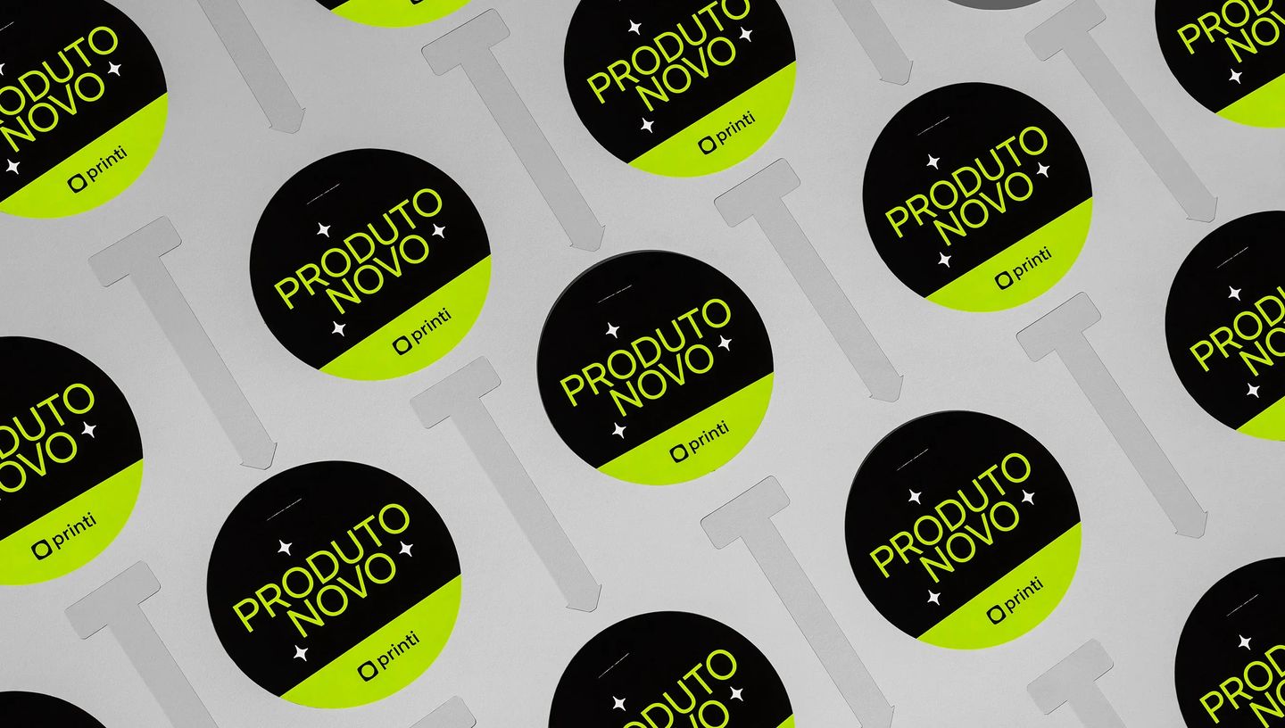 Wobbler promocional redondo com destaque “Produto Novo” para comunicação em ponto de venda.