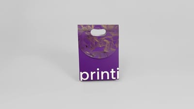 Vista frontal de embalagem tipo sacola roxa personalizada com logotipo Printi e detalhes dourados.